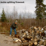 Jackie splits firewood.