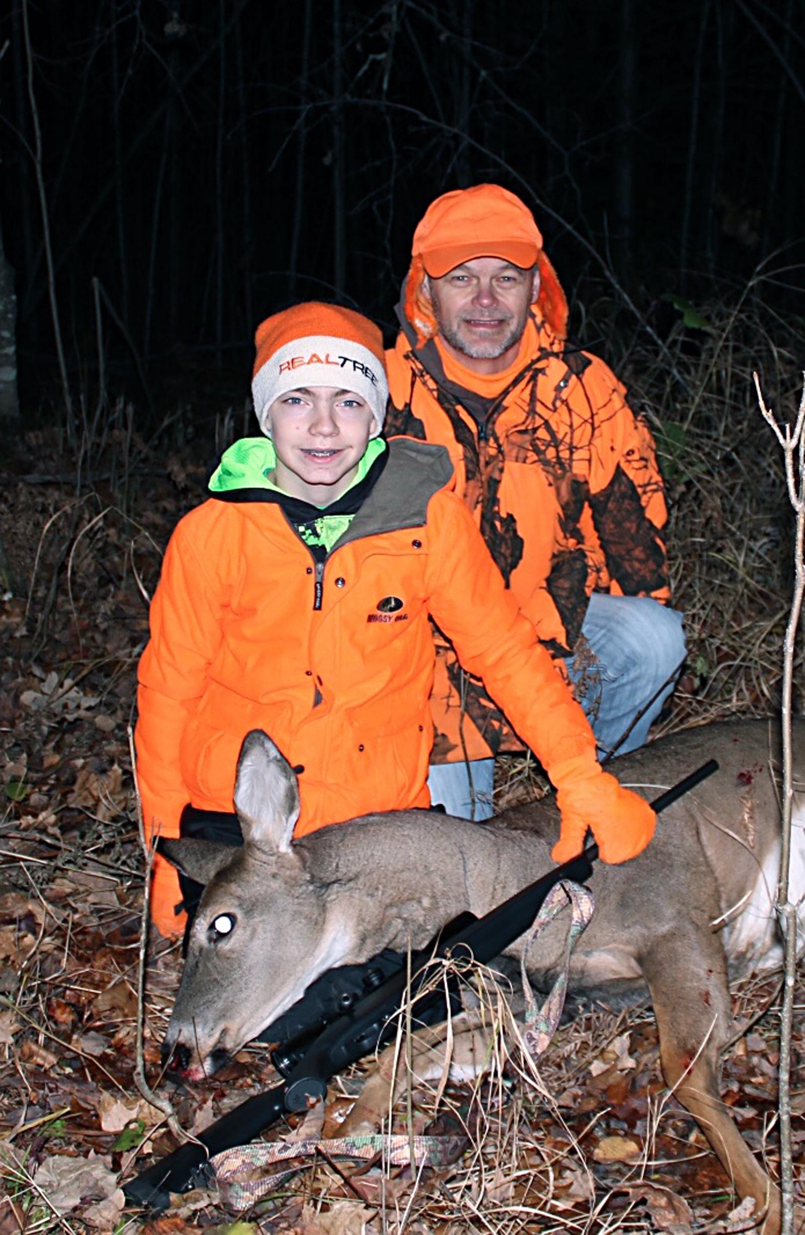 Bill and Mason with his deer. Not bad for 12 years old.